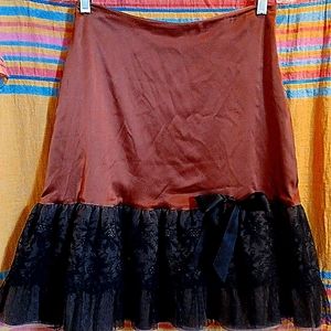 Caramel Silk skirt with taffeta ruffle and satin bow detail by Miguelina Meduim